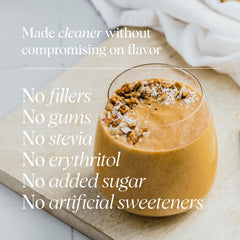 Ora Organic Vanilla Chai smoothie in glass, showcasing creamy texture and flavor.