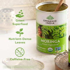 Organic India Moringa Powder closeup reveals vibrant green powder and nutrition.