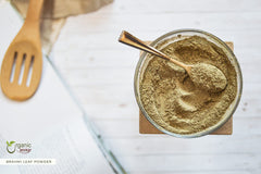Organic Way Brahmi leaf powder with spoon ready for smoothie blends