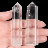 Orientrea clear quartz wand pair for meditation and focus, natural stones in a refined display.