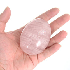 Orientrea Rose Quartz palm stone close-up reveals natural color and a polished surface for soothing touch.