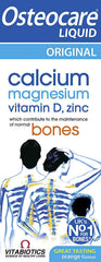Osteocare Bone Health Liquid bottle pour showing calcium with vitamin D for bone support.