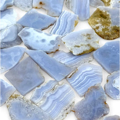 Pachamama Essentials Blue Lace Agate slab on altar conveys tranquil energy for new beginnings.