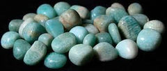 Pachamama Essentials Amazonite tumbled stone with background highlighting heart and throat chakra focus.