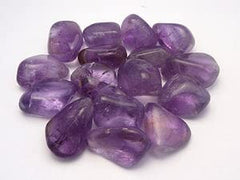 Pachamama Essentials Amethyst stones in a tray, supporting restful sleep and serene dreams.