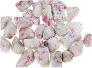 Pachamama Essentials cinnabar stones in hand for focus and wealth potential