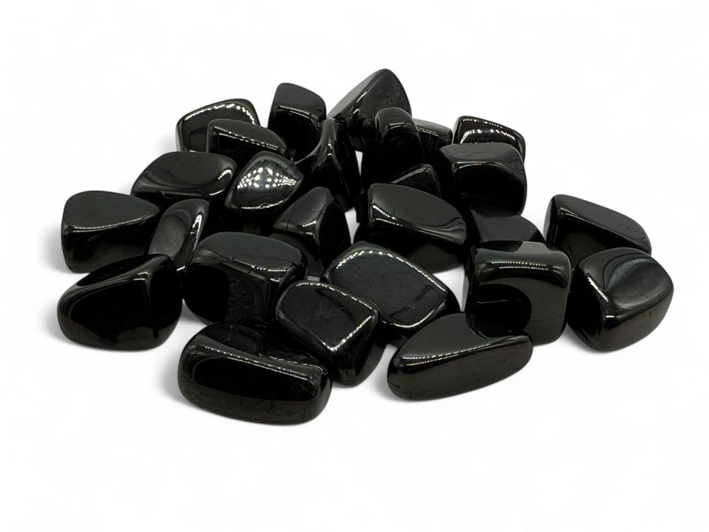 Pachamama Essentials Jet tumbled stone round 3-pack for grounding and aura cleansing.