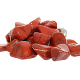 Pachamama Essentials Red Jasper tumbled stone closeup showing grounding energy.