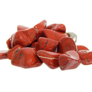 Pachamama Essentials Red Jasper tumbled stone closeup showing grounding energy.