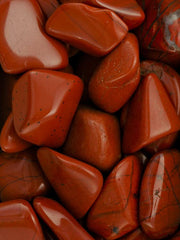 Pachamama Essentials Red Jasper stones arranged for calm desk décor and balance.