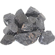 Pachamama Essentials rough black tourmaline crystal closeup for grounding and protective energy.