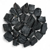 Pachamama Essentials rough black tourmaline stones for grounding and focused work.