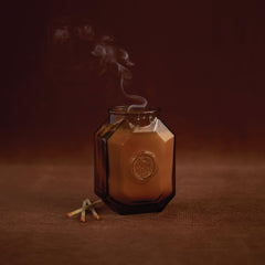 Paddywax Botanica candle with lid and embossed jar showcases elegant design for gifting.