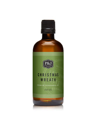 P&J Trading Christmas Wreath Oil bottle pour highlights easy dosing for candles and diffusers.