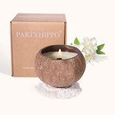 PARTYHIPPO coconut shell candle shown in a natural shell for calming ambience