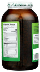 Pines Wheat Grass Tablets being poured into a glass for easy daily greens.