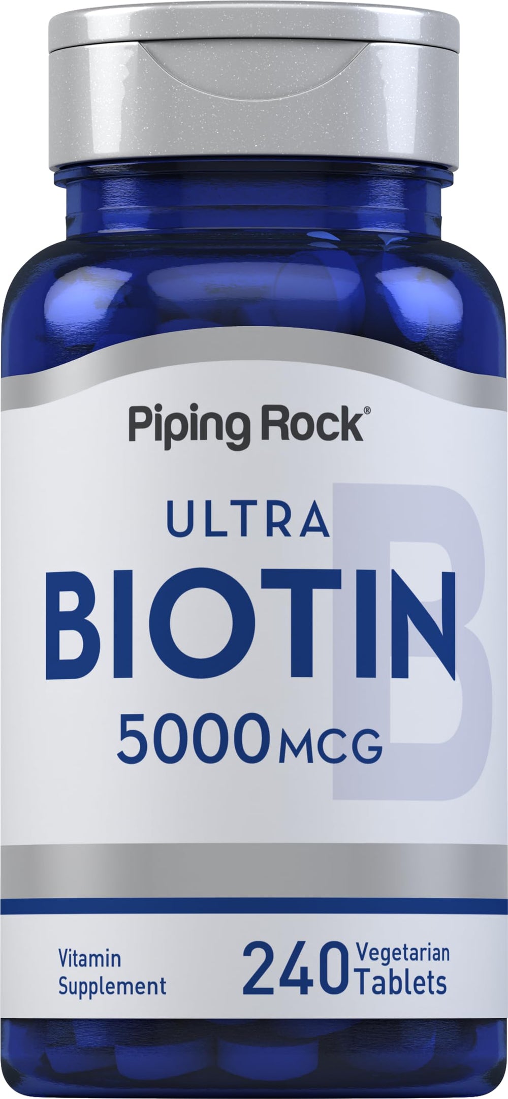 Piping Rock Biotin 5000mcg tablets on a clean surface for beauty support.