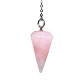 Polar Jade rose quartz pendulum close-up for intuitive dowsing practice
