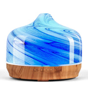 Porseme 500ml glass diffuser with handblown globe in a modern living room.