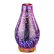 Porseme essential oil diffuser with rose gold glass cover glows softly to create a calming workspace.