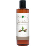 Positive Essence sandalwood massage oil bottle for a smooth, relaxing glide.