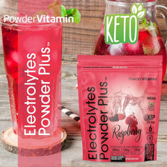PowderVitamin Electrolytes Plus Raspberry measuring scoop beside ready to mix powder