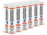 Tabletas de Precision Hydration disolviéndose en agua para una hidratación rápida durante entrenamientos.