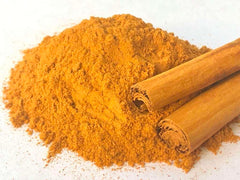 Premium Ceylon Cinnamon Powder pour close-up, ideal for baking and beverages.