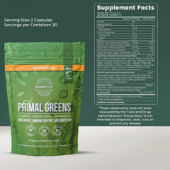 Scoop of Primal Harvest Super Greens Powder ready to blend into drink