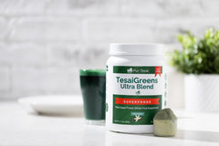 Pur Tesai TesaiGreens Ultra shake poured into a glass for post-workout recovery.