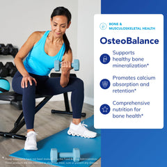 Serving spoon with OsteoBalance showing calcium-rich supplement for daily intake