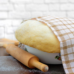Pure Original Ingredients brewer's yeast powder being sprinkled on food.