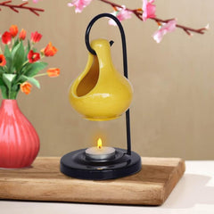 Pure Source India ceramic oil burner yellow, front view with tea light compatibility.