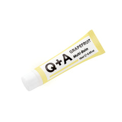 QA Grapefruit Multi-Balm applied to cuticles for nourished fingertips.
