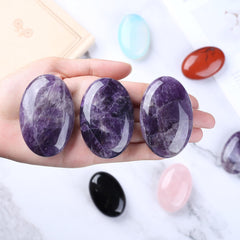 QINJIEJIE amethyst palm stone front view promotes relaxation and meditation.