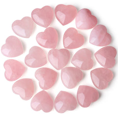 QINJIEJIE rose quartz heart palm stone resting on desk to soften workspace energy