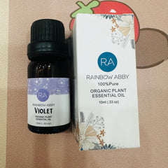 Rainbow Abby violet oil drop close-up highlighting purity and fragrance notes.