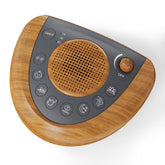 Raynic Noise Machine with a warm wood-grain finish for a cozy sleep setup.