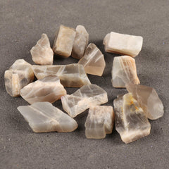 REAL-GEMS raw moonstones close-up showing natural patterns for custom designs.