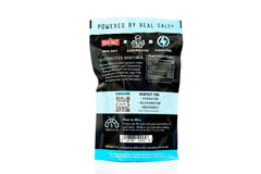 Redmond Re-Lyte unflavored powder being mixed for customizable hydration.