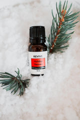 Close look at REVIVEEO Holiday Heaven oil bottle for aromatherapy use