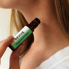 Revive Peppermint Glow Roll-On application on the hairline delivers a soothing, refreshing tingle.