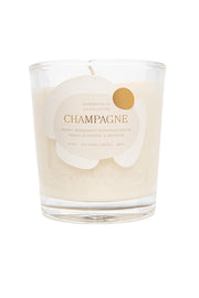 Rewined Champagne scented candle, 10oz bottle, creates elegant ambiance for gatherings.