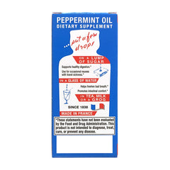 Pouring Ricqlès peppermint oil for easy dosing with water.