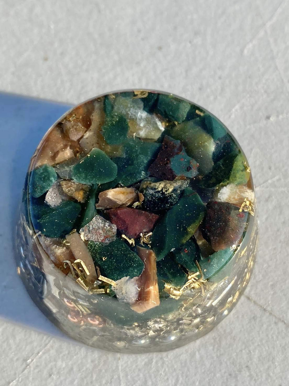 Rise Perspective Bloodstone Orgone Generator top view shows stone layers enhancing calm energy.