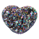 Rockcloud heart-shaped titanium quartz cluster with rainbow facets for meditation and calm energy.
