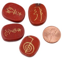 Close-up of hand-carved chakra stones for Reiki practice by Rockcloud.
