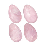 Rockcloud rose quartz egg pocket stone on a desk, smooth texture for calm focus.