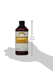 Pouring Rooster Booster B-12 into poultry water to support appetite