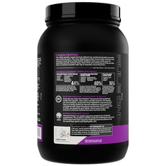 Rule 1 Casein Protein Vanilla Creme powder being stirred into a glass.